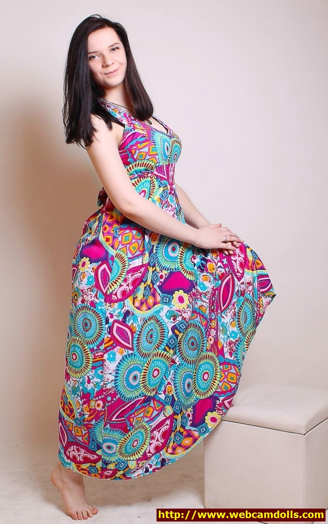 Black Haired Girl wearing Colored Long Dress and showing Foot on Webcamdolls